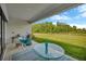 Enjoy the outdoor patio with views of the lush green lawn and trees beyond at 4831 Rosatti Rd, Wesley Chapel, FL 33543