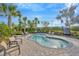 A tranquil spa area surrounded by lush landscaping with comfortable seating and inviting water at 4831 Rosatti Rd, Wesley Chapel, FL 33543