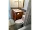 Updated bathroom with a modern vanity, a wood-framed mirror, and a shower with a curtain at 4872 Beach Se Dr # D, St Petersburg, FL 33705