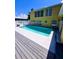 Inviting in-ground pool with a deck, perfect for outdoor entertaining and enjoying sunny days at 5012 Ensign Loop, New Port Richey, FL 34652