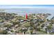 An aerial shot of the lot's location near the water in an upscale residential neighborhood with mature trees at 5029 W Dickens Ave, Tampa, FL 33629