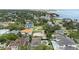 Overview of vacant land in a residential area, perfect for building a dream home near mature trees and landscaping at 5029 W Dickens Ave, Tampa, FL 33629