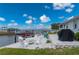 Beautiful backyard featuring a patio, a fire pit, waterfront views, and a boat lift at 5193 Boyle Ter, Port Charlotte, FL 33981