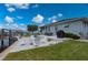 Spacious backyard featuring a patio, a fire pit, waterfront views, and a boat lift at 5193 Boyle Ter, Port Charlotte, FL 33981