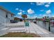 Spacious backyard featuring a patio, a fire pit, waterfront views, and a boat lift at 5193 Boyle Ter, Port Charlotte, FL 33981