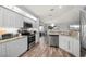 Bright kitchen with stainless steel appliances and wood floors at 5193 Boyle Ter, Port Charlotte, FL 33981