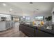 Spacious living area with a large sectional sofa and an open view to the kitchen at 5193 Boyle Ter, Port Charlotte, FL 33981