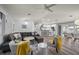 Living room and kitchen with a large sectional, modern furniture, and open layout at 5193 Boyle Ter, Port Charlotte, FL 33981