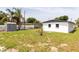 Backyard with shed and tree next to the home at 5210 S 80Th St, Tampa, FL 33619