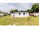 A well maintained backyard shows the property lines, and the back of the home at 5210 S 80Th St, Tampa, FL 33619