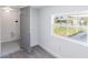 Finished basement featuring stylish gray door, and a bright window at 5210 S 80Th St, Tampa, FL 33619