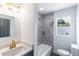 Elegant bathroom with a marble tiled shower, modern vanity, and stylish fixtures at 5210 S 80Th St, Tampa, FL 33619
