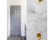 Beautiful bathroom featuring a marble tiled shower and modern gray door at 5210 S 80Th St, Tampa, FL 33619