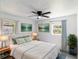 Inviting bedroom with a comfortable bed, soft lighting, and serene artwork at 5210 S 80Th St, Tampa, FL 33619