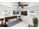 Modern bedroom with comfortable bed, mounted TVs, and sleek nightstands at 5210 S 80Th St, Tampa, FL 33619