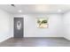 Bright room showcasing a stained glass front door and wood flooring at 5210 S 80Th St, Tampa, FL 33619