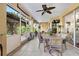 Spacious screened porch with outdoor dining and lounging areas perfect for entertaining at 5296 Slater Rd, Spring Hill, FL 34608