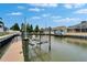 Private dock and boat lift showcasing convenient waterfront living at 5608 Skimmer Dr, Apollo Beach, FL 33572