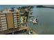 Elevated aerial view of a waterfront condominium, boat dock, parking and water views at 5701 Mariner St # 701, Tampa, FL 33609