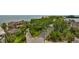 Aerial view of the property showcasing the home, lush landscaping, and proximity to the water at 5701 Mariner St # 701, Tampa, FL 33609