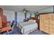 Bright bedroom boasts a ceiling fan, mirrored walls, built-in storage, and large closets at 5701 Mariner St # 701, Tampa, FL 33609