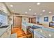 Open kitchen design with stainless steel appliances and seamless access to the living area at 5701 Mariner St # 701, Tampa, FL 33609