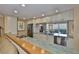 Open kitchen with stone countertops, stainless steel appliances, and a view to the water at 5701 Mariner St # 701, Tampa, FL 33609