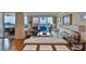A living room showcases a sitting area and balcony access to the water views at 5701 Mariner St # 701, Tampa, FL 33609