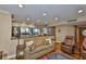 Inviting living room featuring a stylish sofa and direct access to the kitchen with water views at 5701 Mariner St # 701, Tampa, FL 33609