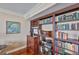 Detail of a built-in bookcase with decorative items and ample shelving space at 5701 Mariner St # 701, Tampa, FL 33609