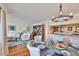 Bright, open-concept living space featuring hardwood floors and seamless flow into the dining area and kitchen at 5701 Mariner St # 701, Tampa, FL 33609