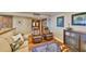 Comfortable living room with hardwood floors and stylish furniture connecting to double door entry at 5701 Mariner St # 701, Tampa, FL 33609