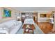 Inviting living room with hardwood floors, neutral decor, and a cozy seating area at 5701 Mariner St # 701, Tampa, FL 33609