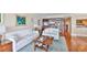A well-appointed living room with a built-in bookshelf and views into the kitchen at 5701 Mariner St # 701, Tampa, FL 33609
