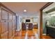 Spacious living room with hardwood floors leading to adjacent bathroom at 5701 Mariner St # 701, Tampa, FL 33609