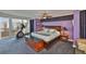 Spacious main bedroom featuring ceiling fan, exercise equipment, and balcony access at 5701 Mariner St # 701, Tampa, FL 33609