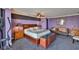 Spacious main bedroom featuring bedside tables, art, and comfortable seating at 5701 Mariner St # 701, Tampa, FL 33609