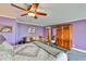 Comfortable main bedroom with wooden cabinet, seating, and art at 5701 Mariner St # 701, Tampa, FL 33609