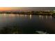 Scenic evening view of the waterfront showcasing city lights reflecting off the calm water at 5701 Mariner St # 701, Tampa, FL 33609