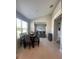 Dining area with a modern table, stylish chairs, and large windows providing natural light at 5924 Fieldmoor Ct, Palmetto, FL 34221
