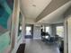 Bright entryway with modern art, tile flooring, and an open view into the dining room at 5924 Fieldmoor Ct, Palmetto, FL 34221