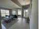 Inviting entryway with tile floors, a decorative bench, and an open view of the dining area at 5924 Fieldmoor Ct, Palmetto, FL 34221