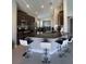 Modern kitchen featuring granite countertops, stainless steel appliances, and breakfast bar seating at 5924 Fieldmoor Ct, Palmetto, FL 34221