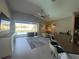Bright living room featuring a seamless transition to the outdoor pool area at 5924 Fieldmoor Ct, Palmetto, FL 34221