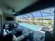 Inviting screened-in pool area with ample seating and a tranquil view at 5924 Fieldmoor Ct, Palmetto, FL 34221