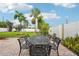 Backyard patio area with an ornate metal table and chairs at 6010 Bayou Grande Ne Blvd, St Petersburg, FL 33703