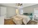Bright bedroom featuring wood floors, large windows, and a comfortable bench at 6010 Bayou Grande Ne Blvd, St Petersburg, FL 33703