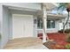 Inviting double front doors with wood-look tile entryway, creating a warm welcome at 6010 Bayou Grande Ne Blvd, St Petersburg, FL 33703