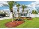Charming single-story home with a well-maintained front yard, mature palms, and a two-car garage at 6010 Bayou Grande Ne Blvd, St Petersburg, FL 33703
