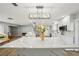 Spacious kitchen with white marble countertops, stainless steel appliances, and a center island at 6010 Bayou Grande Ne Blvd, St Petersburg, FL 33703